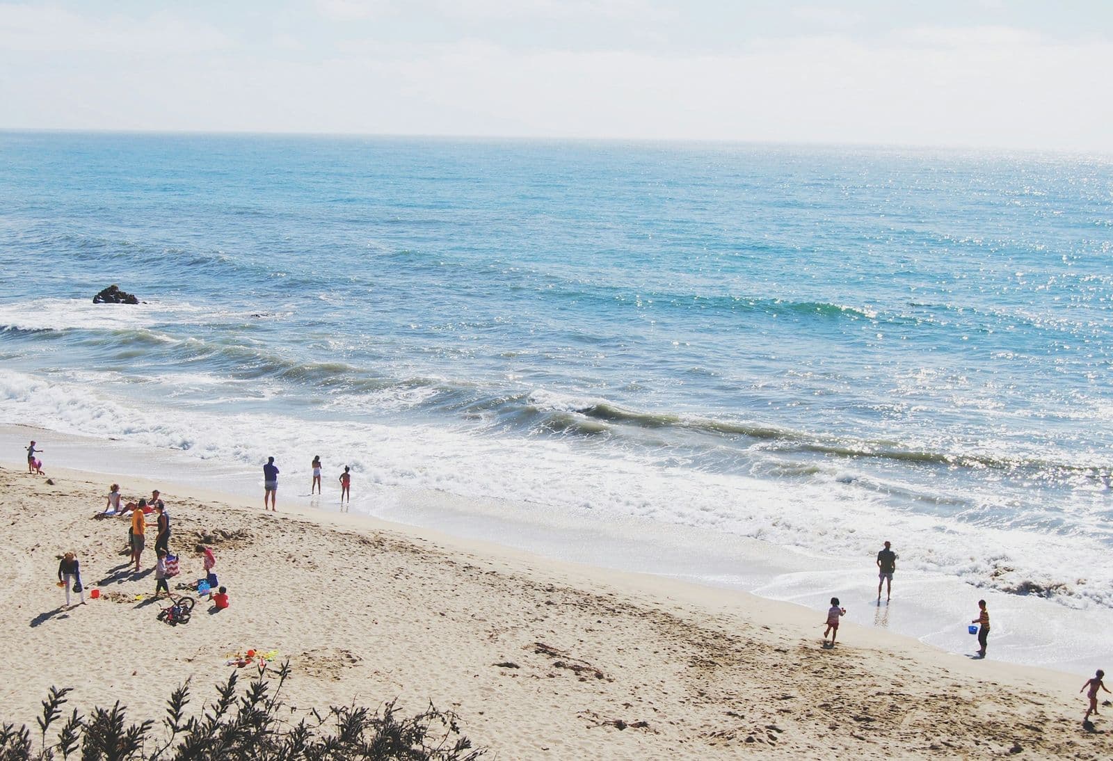 A family beach day by the waves